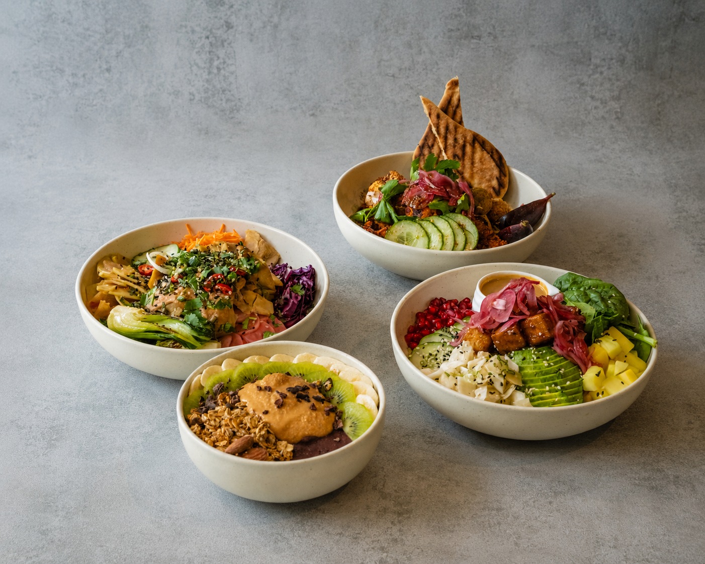 A selection of Wild Bowls on a pale stone table